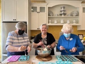 Jean Deo and Rita preparing chocolate easter eggs